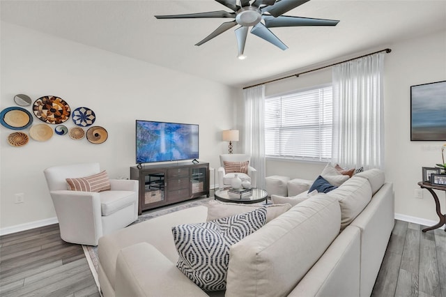 living room with hardwood / wood-style floors and ceiling fan