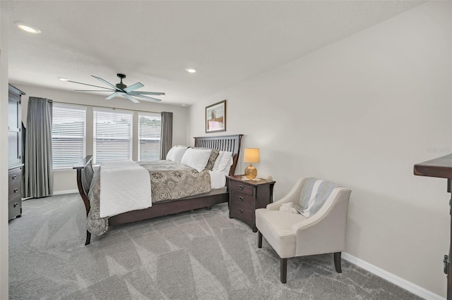 bedroom with light carpet and ceiling fan