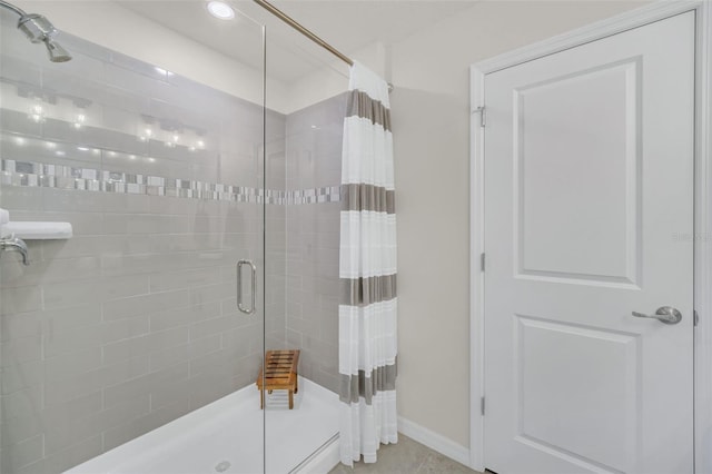 bathroom with a tile shower