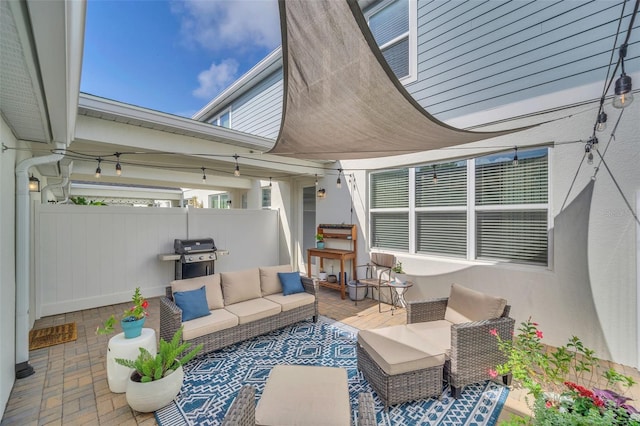 view of patio with grilling area and an outdoor hangout area