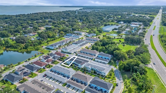 drone / aerial view with a water view