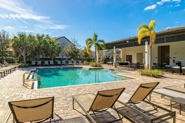 view of swimming pool featuring a patio area