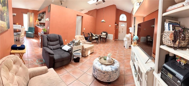 tiled living room featuring vaulted ceiling