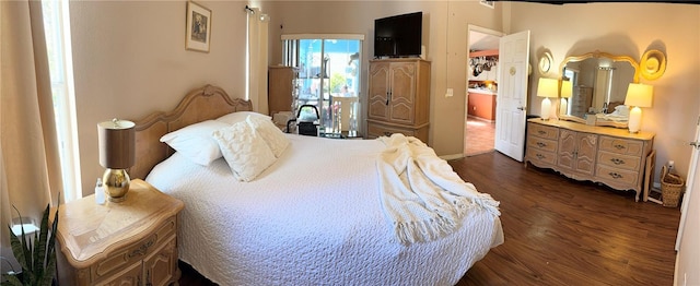 bedroom featuring dark hardwood / wood-style flooring