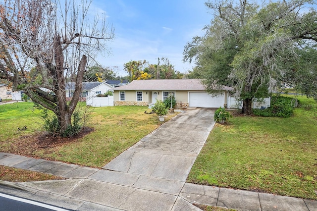 ranch-style house featuring a garage and a front yard