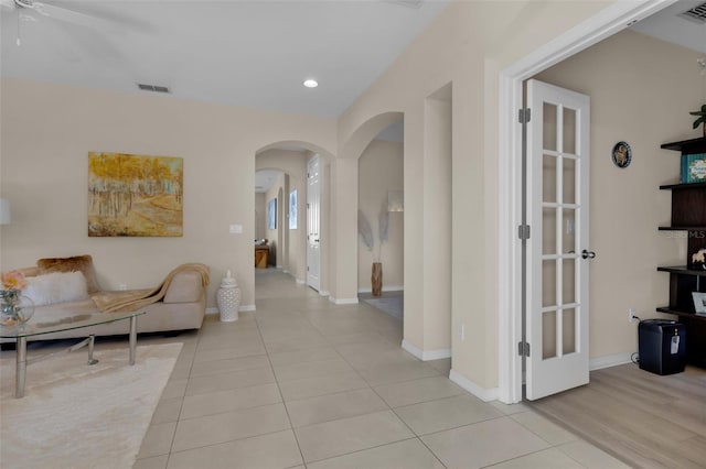 hallway with light tile patterned flooring