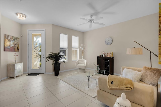 tiled living room featuring ceiling fan