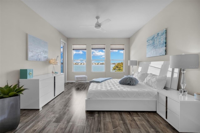 bedroom with dark wood-type flooring and ceiling fan