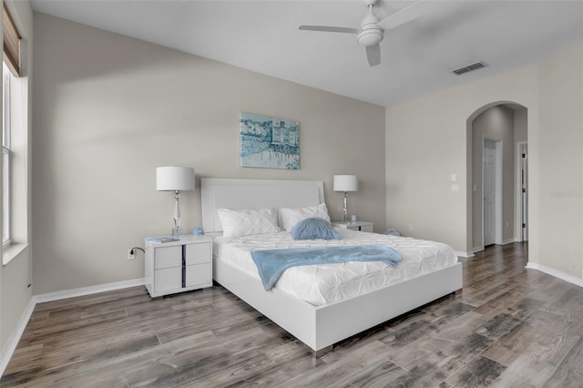 bedroom with ceiling fan and wood-type flooring