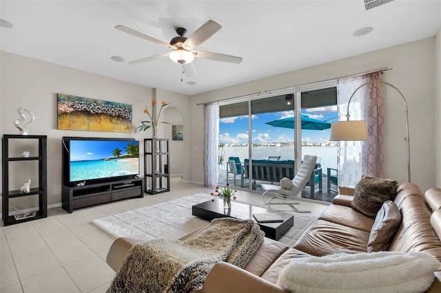 tiled living room featuring ceiling fan