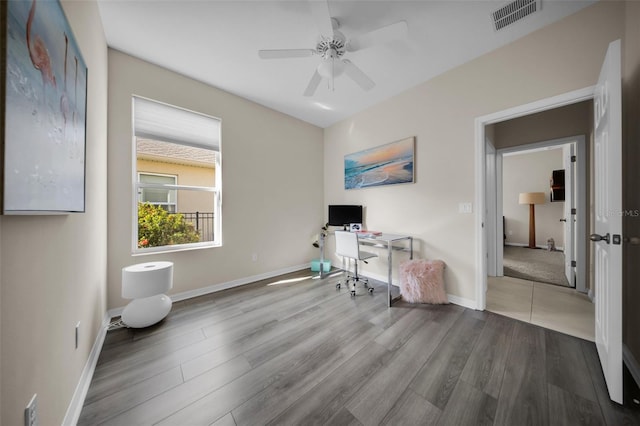 office with ceiling fan and hardwood / wood-style floors