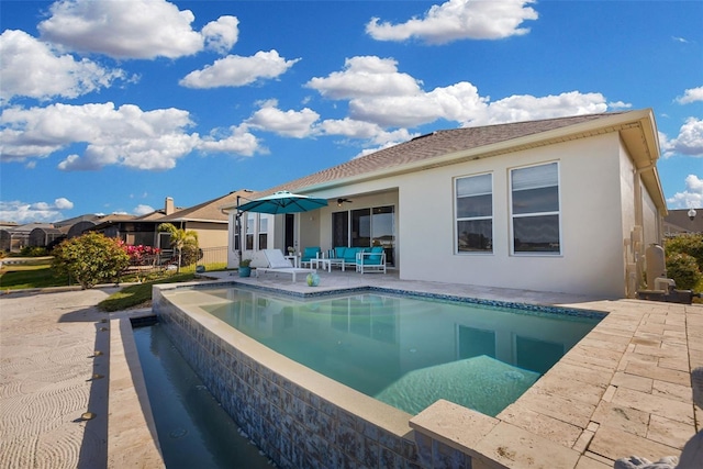 rear view of property with a patio