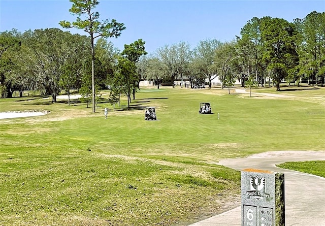 surrounding community featuring a lawn