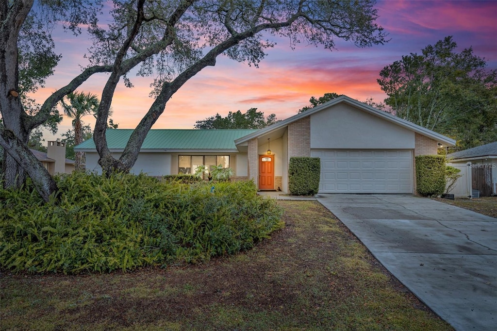 ranch-style home with a garage