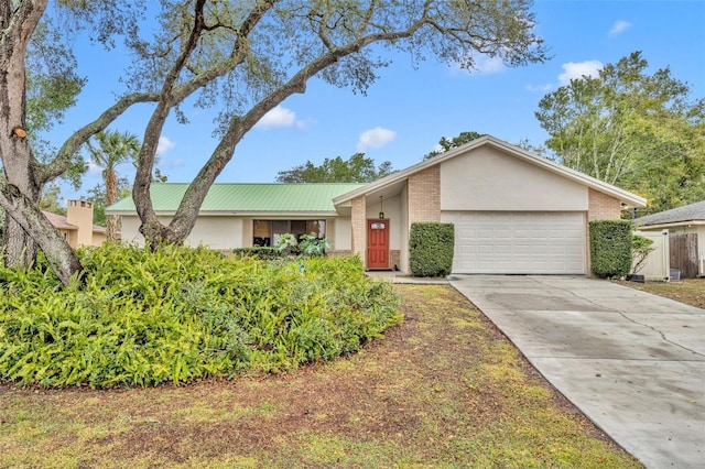 ranch-style home featuring a garage