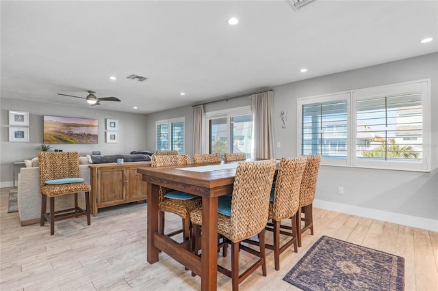 dining space featuring ceiling fan, plenty of natural light, and light wood-type flooring