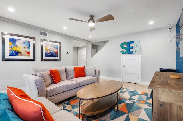 living room featuring ceiling fan, light wood-style floors, recessed lighting, baseboards, and visible vents