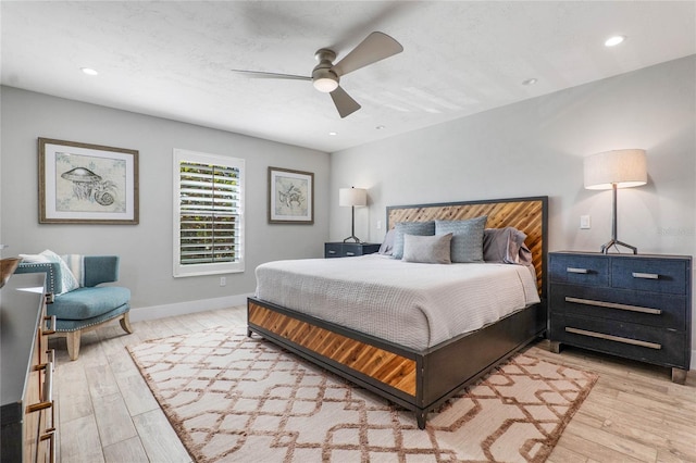 bedroom featuring light wood-style floors, baseboards, a ceiling fan, and recessed lighting