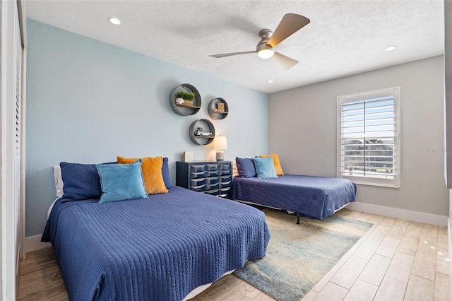 bedroom with baseboards, ceiling fan, recessed lighting, and wood finished floors