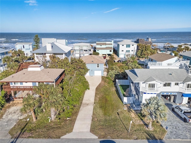 aerial view with a water view and a residential view