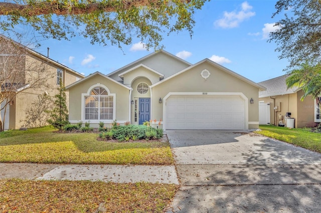 view of front of property with a garage and a front yard