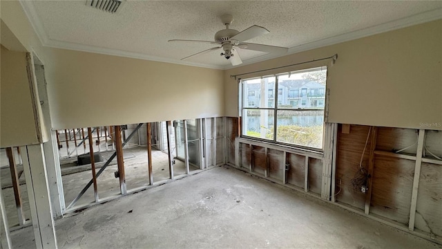 misc room featuring crown molding, ceiling fan, and a textured ceiling