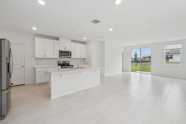 kitchen featuring recessed lighting, visible vents, appliances with stainless steel finishes, and open floor plan