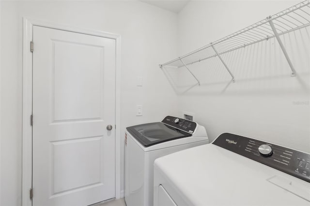 laundry area with laundry area and washer and clothes dryer