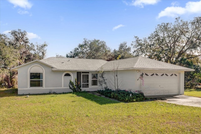 single story home featuring a garage and a front lawn