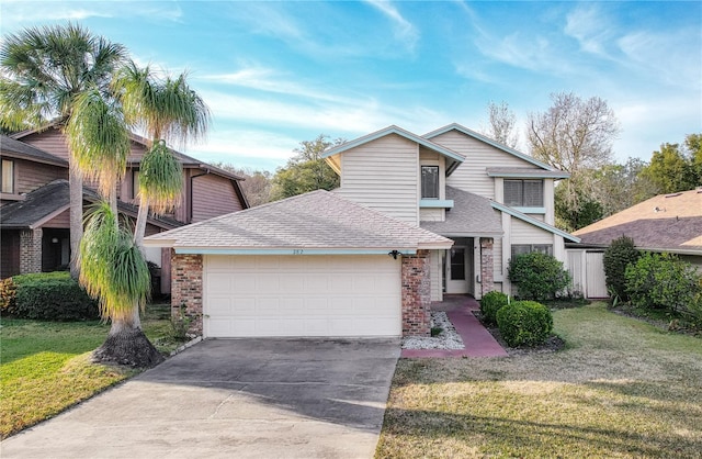 view of front of property with a garage and a front lawn