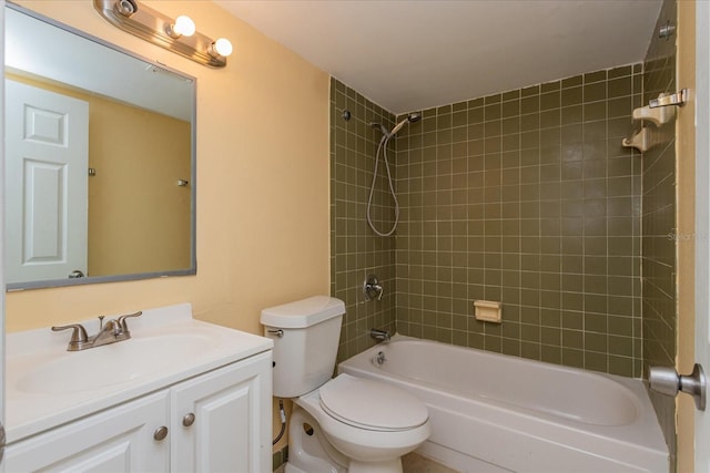 full bathroom featuring vanity, toilet, and tiled shower / bath