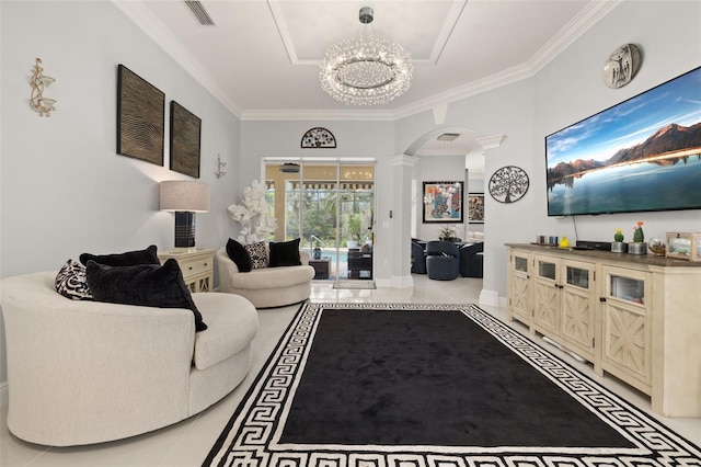 living room with decorative columns, crown molding, light tile patterned floors, and a chandelier