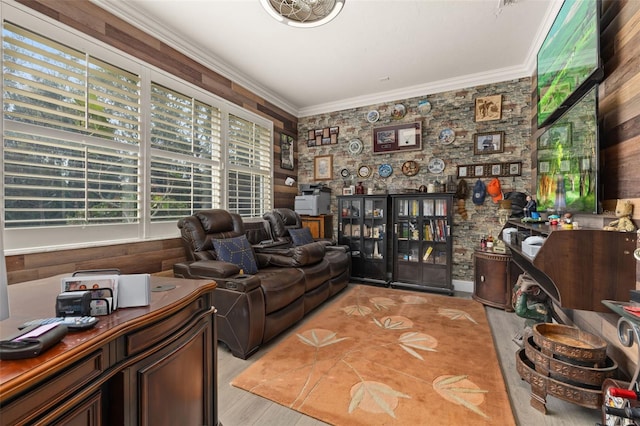 living room with crown molding and light wood-type flooring