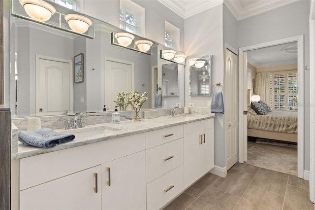 bathroom featuring vanity, tile patterned flooring, and ornamental molding