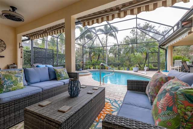 view of pool with a patio, outdoor lounge area, and a lanai