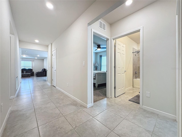 hallway featuring light tile patterned flooring