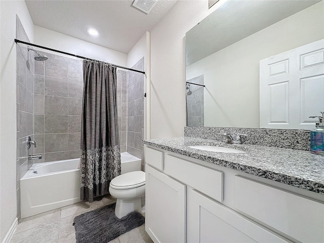 full bathroom featuring vanity, shower / tub combo, a textured ceiling, and toilet