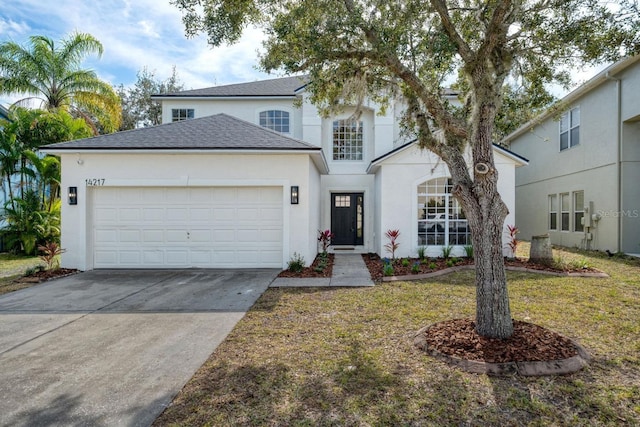 view of front property with a garage and a front lawn