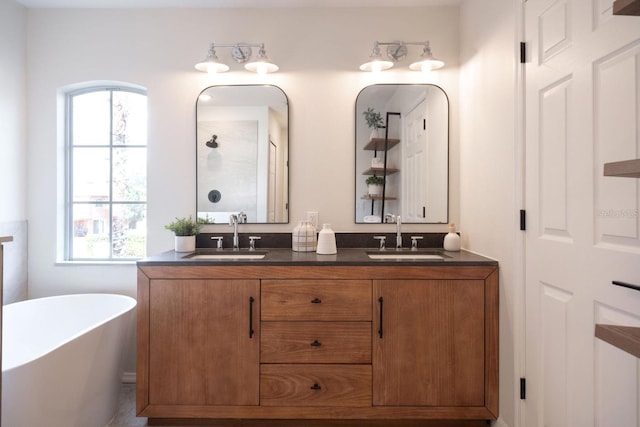 bathroom with vanity and independent shower and bath