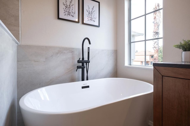 bathroom featuring a tub to relax in