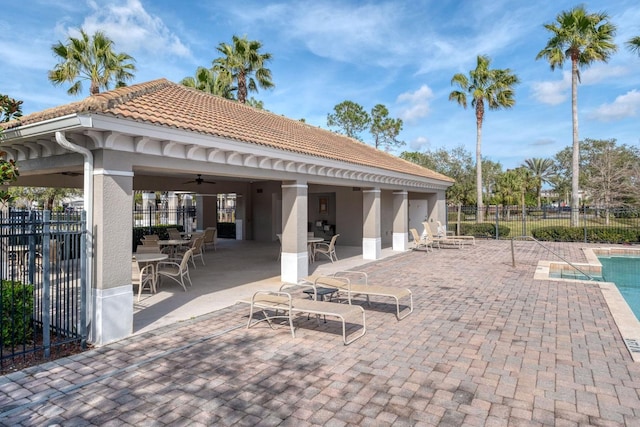 view of patio / terrace with a community pool and ceiling fan