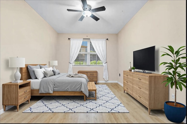 bedroom with ceiling fan and light wood-type flooring