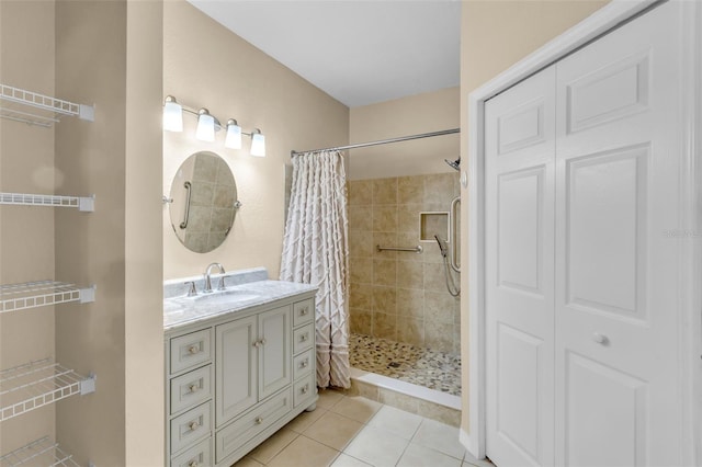 bathroom with vanity, curtained shower, and tile patterned floors