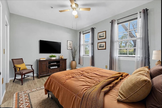 bedroom featuring ceiling fan and light wood-type flooring