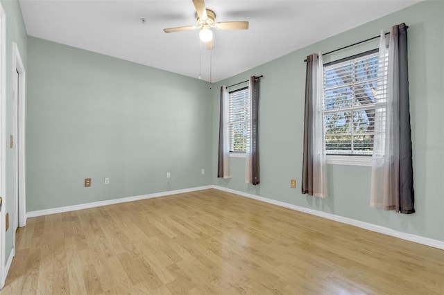 spare room with ceiling fan and light hardwood / wood-style flooring