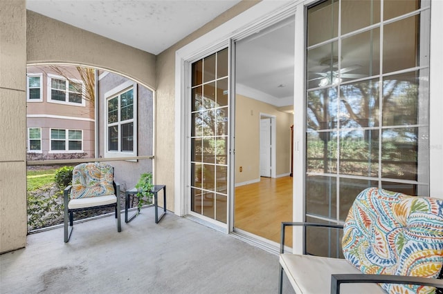 sunroom / solarium with ceiling fan