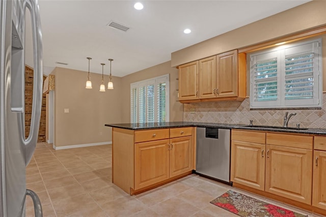 kitchen with decorative light fixtures, dishwasher, sink, fridge, and kitchen peninsula