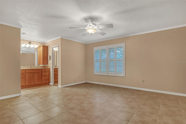 tiled spare room with ceiling fan, ornamental molding, sink, and a textured ceiling