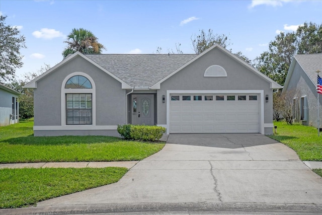 ranch-style home with driveway, roof with shingles, an attached garage, a front lawn, and stucco siding