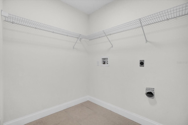 washroom featuring washer hookup, hookup for an electric dryer, and tile patterned floors